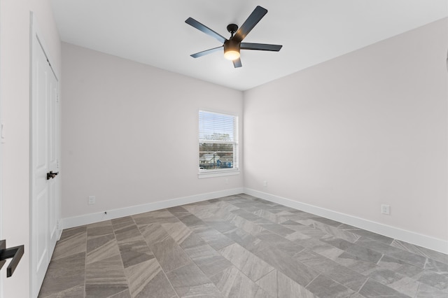 unfurnished bedroom with a closet, ceiling fan, and baseboards