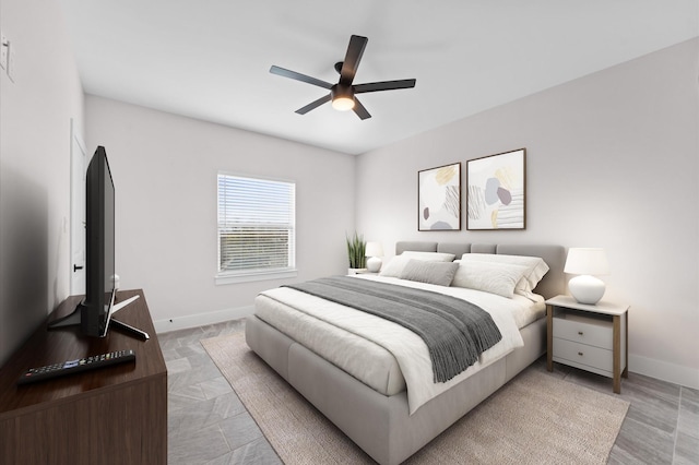 bedroom with baseboards and ceiling fan