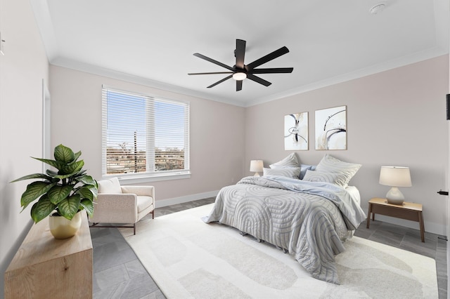 bedroom featuring crown molding, a ceiling fan, and baseboards