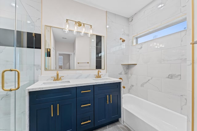 bathroom with a sink, enclosed tub / shower combo, and double vanity