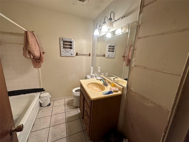 bathroom featuring toilet, tile patterned flooring, bathing tub / shower combination, and vanity