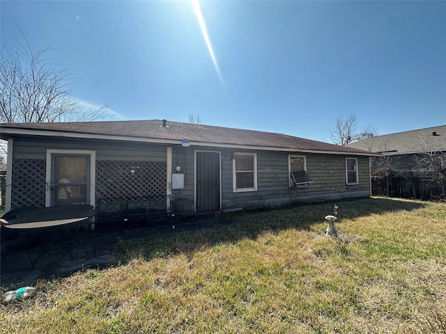 back of house with a yard