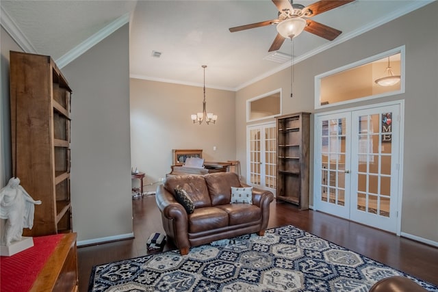 living room featuring french doors, wood finished floors, crown molding, and ceiling fan with notable chandelier