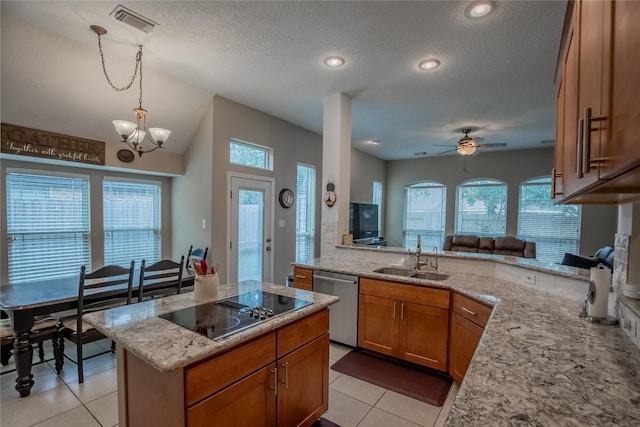 kitchen with dishwasher, light stone countertops, brown cabinets, and a sink