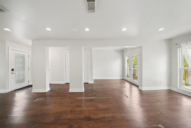 interior space with recessed lighting, wood finished floors, and a wealth of natural light