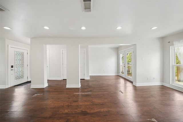 unfurnished living room featuring baseboards, recessed lighting, and visible vents