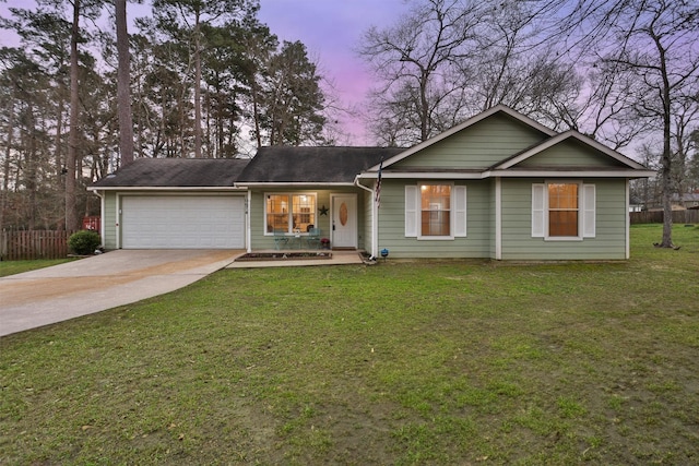 ranch-style house with a porch, fence, a garage, driveway, and a front lawn