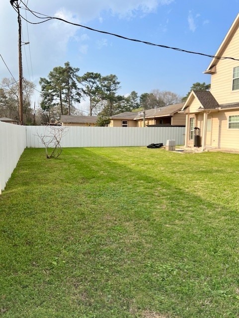 view of yard with a fenced backyard