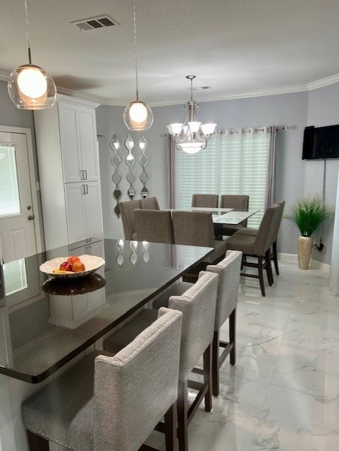 dining space with marble finish floor, baseboards, visible vents, and crown molding