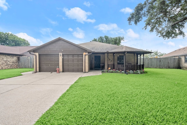 ranch-style home featuring concrete driveway, an attached garage, fence, a front lawn, and brick siding