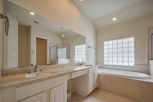 full bathroom featuring a bath, a shower stall, a sink, and tile patterned floors