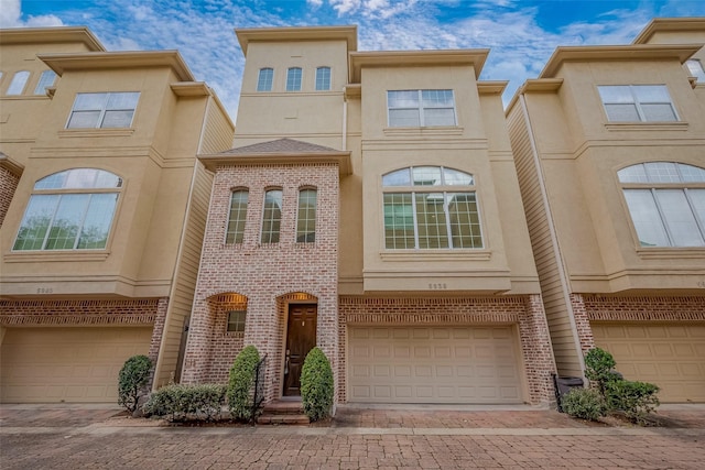 5938 Kansas St, Houston, TX 77007 - multi unit property featuring a garage, decorative driveway, and brick siding