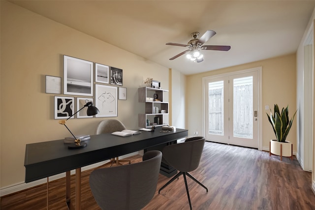 home office featuring wood finished floors, a ceiling fan, and baseboards