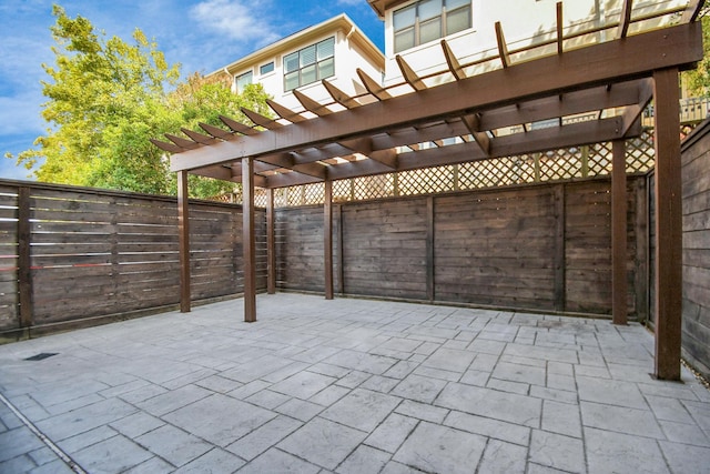 view of patio featuring a pergola and a fenced backyard