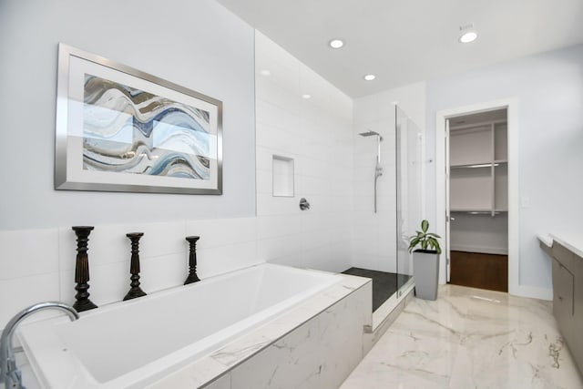 full bathroom with a garden tub, recessed lighting, a stall shower, marble finish floor, and vanity