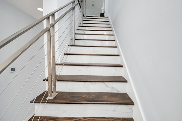 stairway featuring recessed lighting