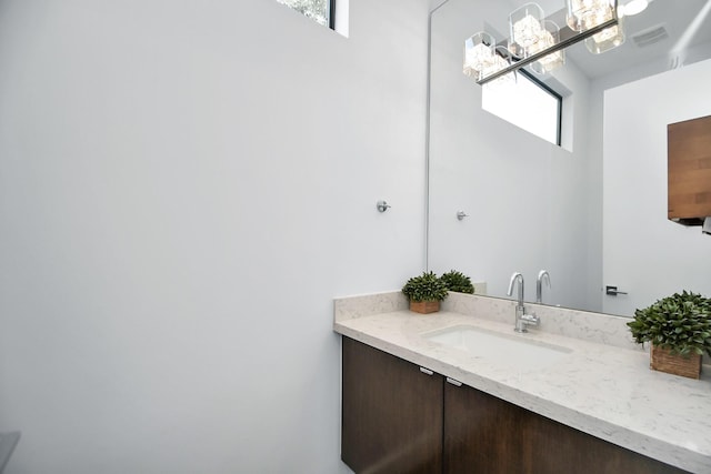 bathroom with visible vents and vanity