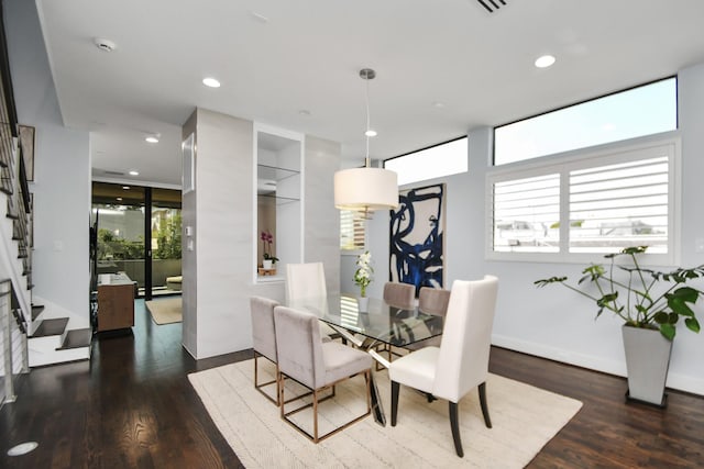 dining area with stairway, recessed lighting, baseboards, and wood finished floors