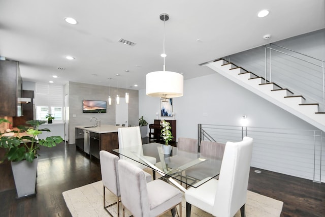 dining space featuring recessed lighting, visible vents, dark wood finished floors, and stairs