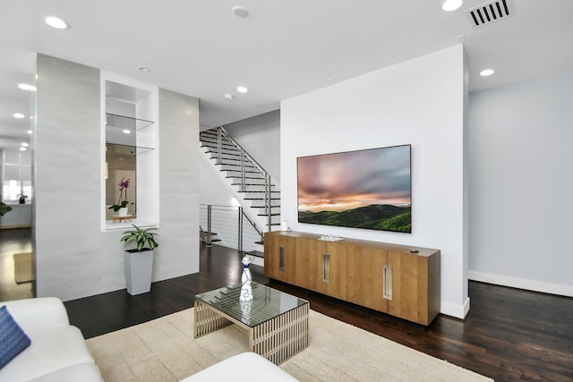 living room featuring stairway, wood finished floors, visible vents, baseboards, and recessed lighting