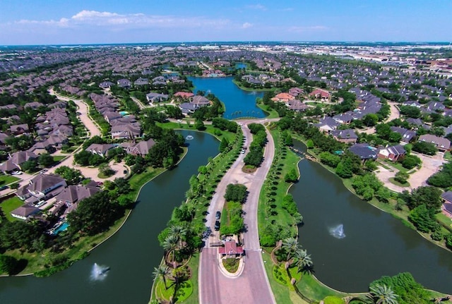 bird's eye view with a residential view and a water view