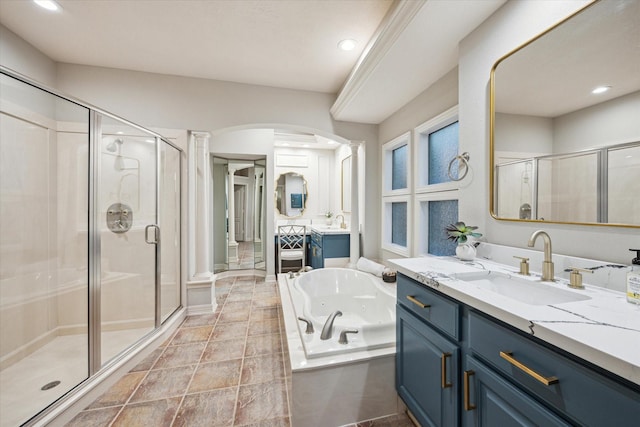 bathroom featuring two vanities, recessed lighting, a whirlpool tub, a sink, and a shower stall