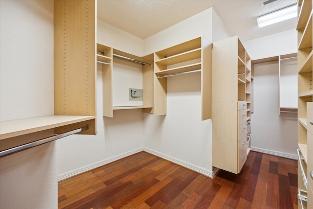 walk in closet with visible vents and wood finished floors