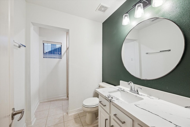 bathroom with visible vents, toilet, tile patterned flooring, baseboards, and vanity