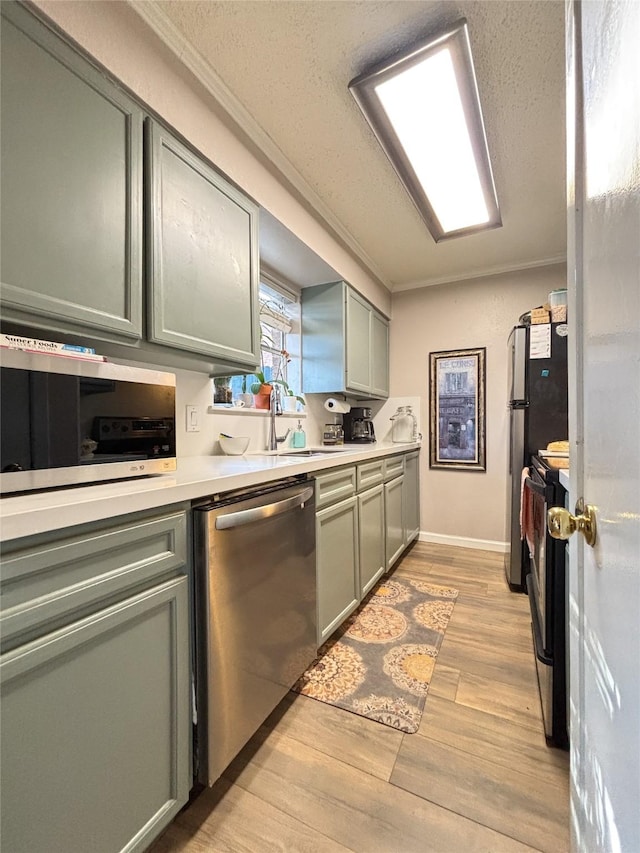 kitchen with a sink, electric stove, ornamental molding, stainless steel dishwasher, and light countertops