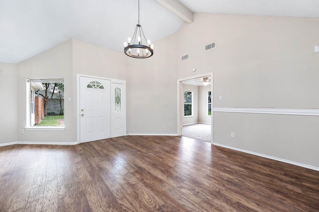 foyer with wood finished floors, visible vents, baseboards, beam ceiling, and an inviting chandelier