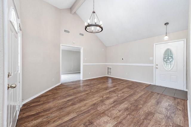 entrance foyer with wood finished floors, visible vents, and an inviting chandelier