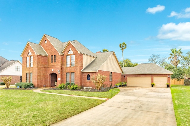 traditional-style house with a garage, a front lawn, and brick siding