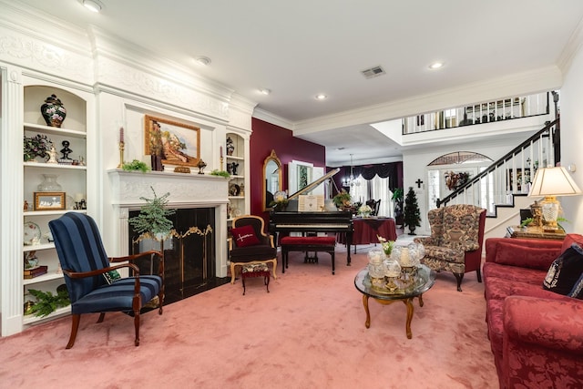 carpeted living area with stairs, ornamental molding, a fireplace, and built in features