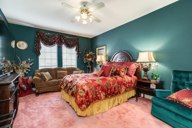 bedroom featuring ceiling fan and carpet