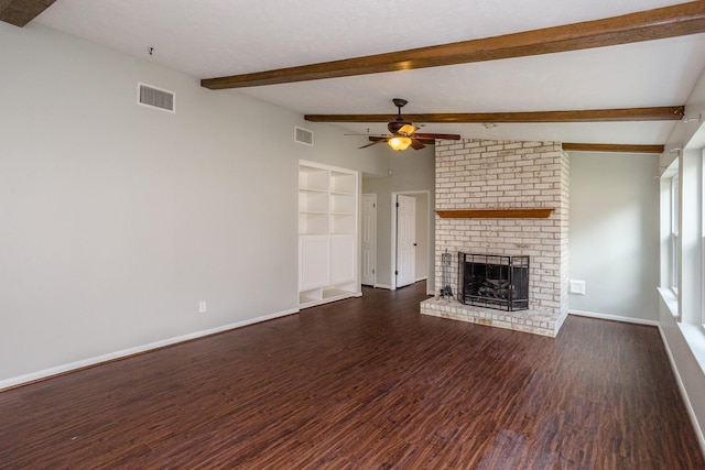 unfurnished living room featuring a brick fireplace, baseboards, visible vents, and wood finished floors