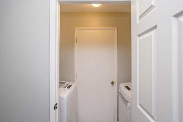 laundry room featuring laundry area and washing machine and dryer