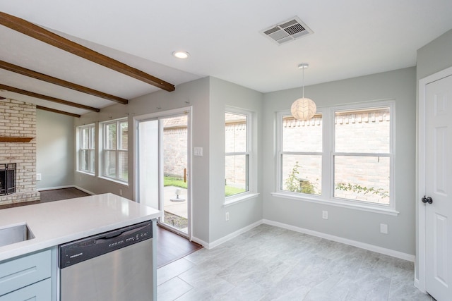 kitchen with beam ceiling, a fireplace, light countertops, visible vents, and dishwasher