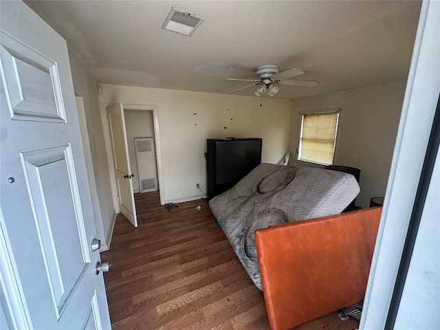 bedroom featuring visible vents and wood finished floors