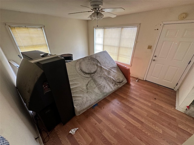 bedroom with wood finished floors and a ceiling fan