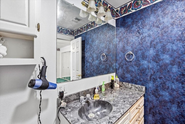 bathroom with visible vents and vanity