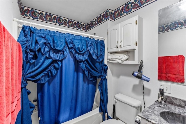 full bath featuring toilet, a sink, and shower / bath combo with shower curtain