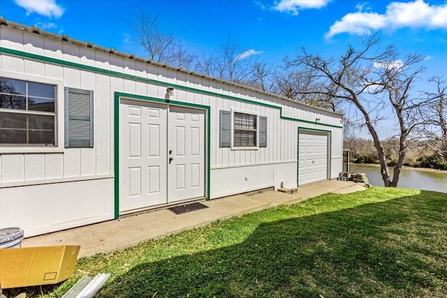 view of outbuilding with a water view