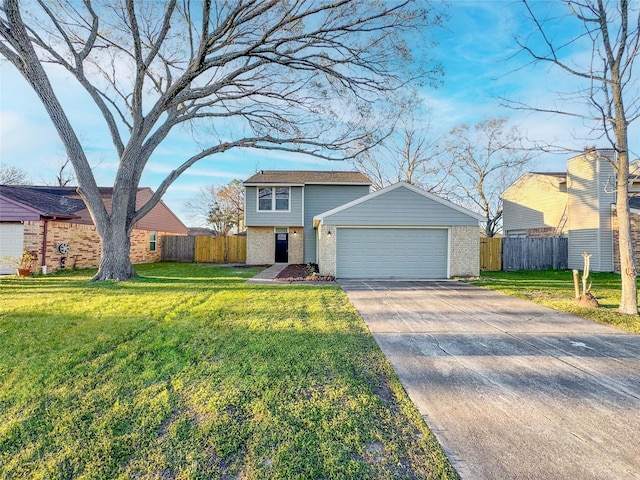 view of front of home with concrete driveway, an attached garage, fence, a front lawn, and brick siding