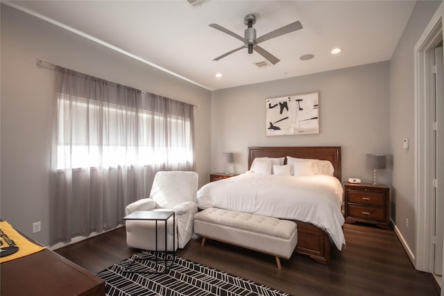 bedroom with recessed lighting, wood finished floors, visible vents, and baseboards