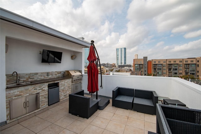 view of patio with outdoor lounge area, grilling area, an outdoor kitchen, and a sink