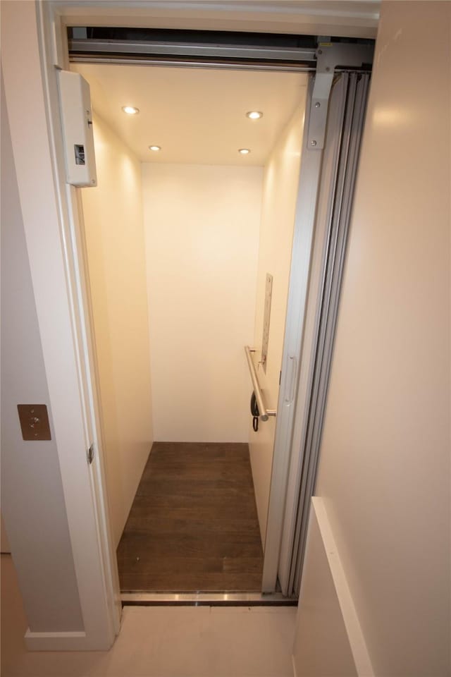 room details with elevator and recessed lighting