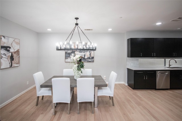 dining area with light wood-style flooring, recessed lighting, baseboards, and visible vents