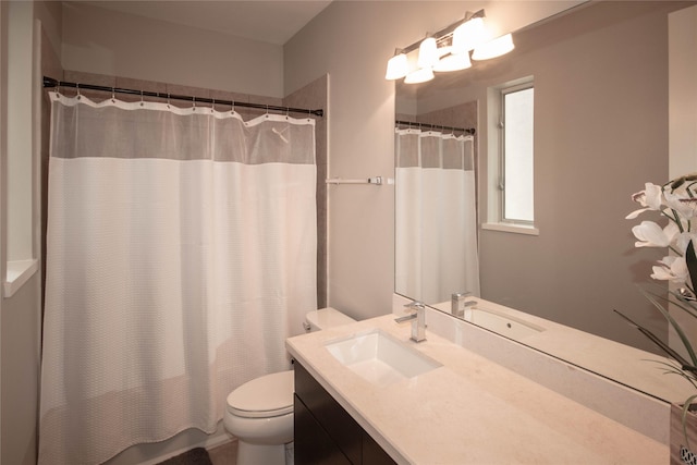 full bathroom with vanity and toilet