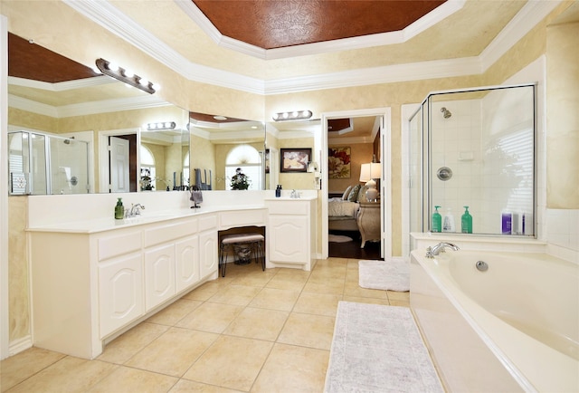 ensuite bathroom with tile patterned flooring, a shower stall, crown molding, ensuite bathroom, and vanity