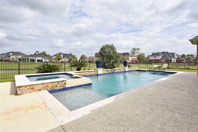 view of swimming pool with a yard, a fenced backyard, a pool with connected hot tub, a patio area, and a residential view